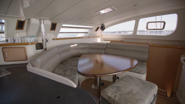 A boat with a table and chairs in it