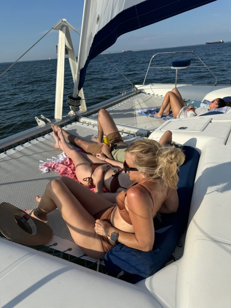 A group of people on a boat in the water.
