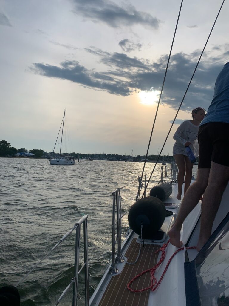 A group of people on a boat in the water.